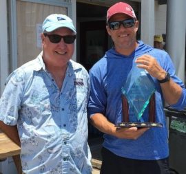 Alliance president Mark LeNeave (left) thanks College sailing director Kevin Jewett for his team's great work on Championship 2019.